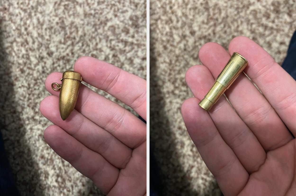 Two hands holding an object shaped like a brass bullet that opens to reveal a small compartment inside
