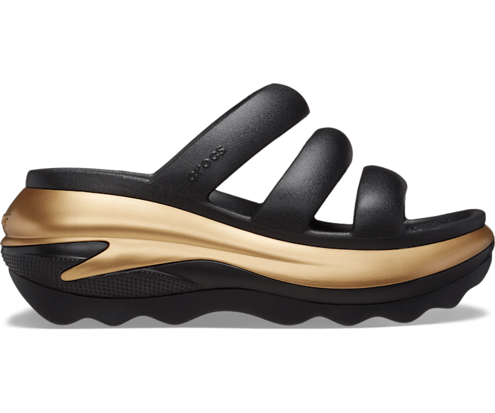 Side view of a black sandal with three straps and a thick, curved sole featuring gold accents