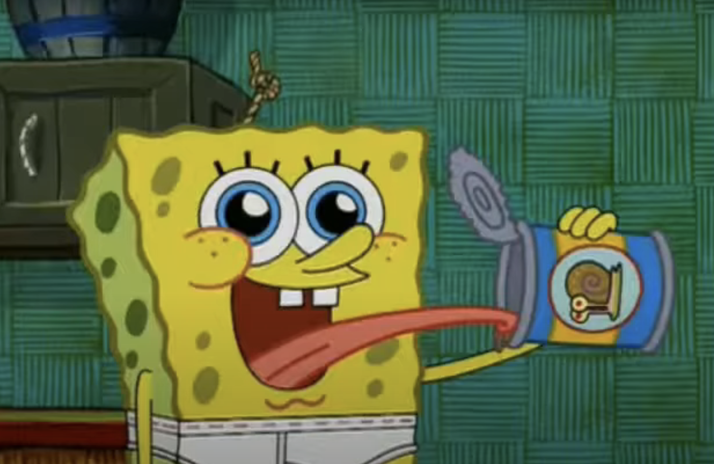 SpongeBob SquarePants is excitedly holding an opened can with a picture of a snail on it, sticking his tongue out enthusiastically