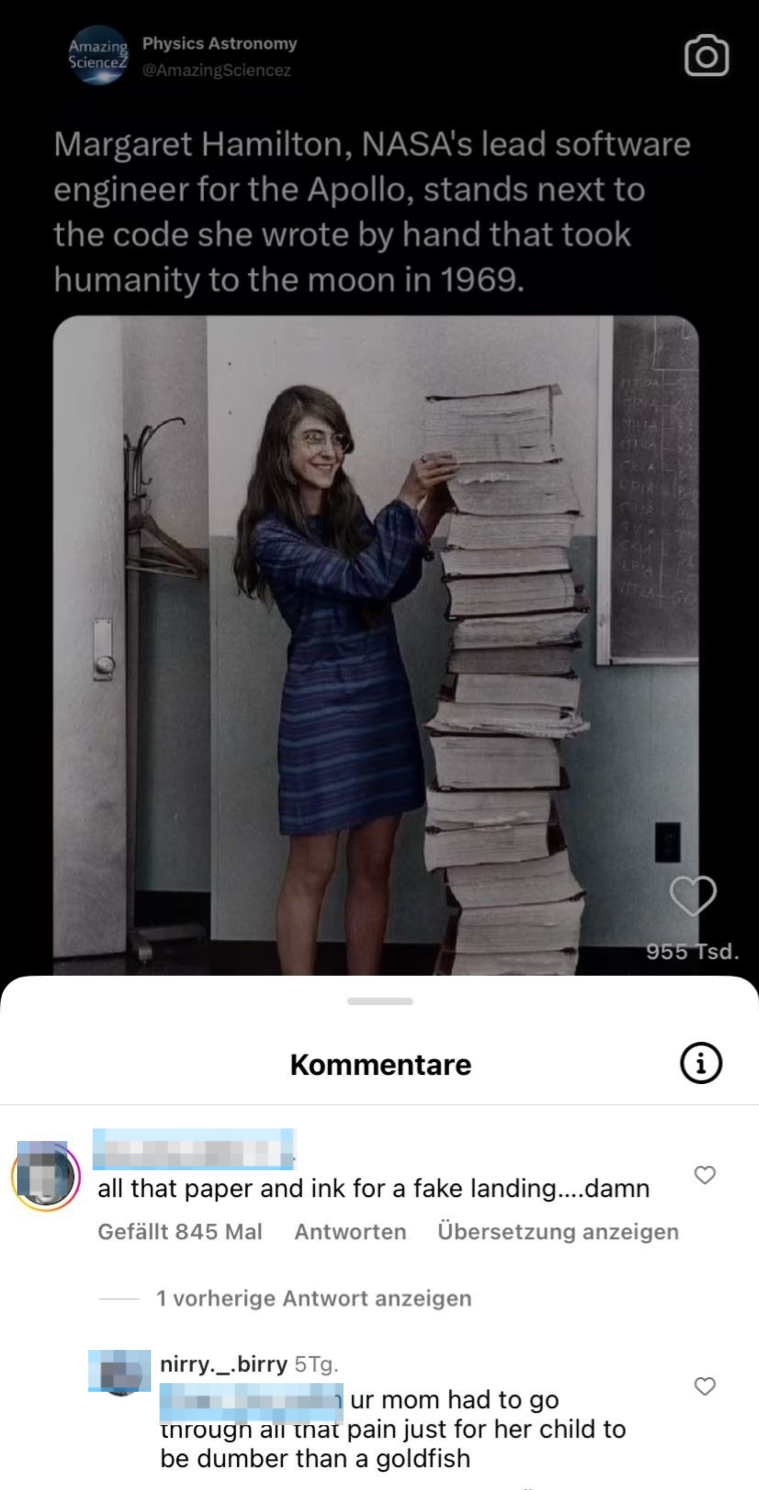 Margaret Hamilton stands beside a large stack of paper containing the Apollo code she wrote by hand in 1969. Comments below talk about the space landing being fake