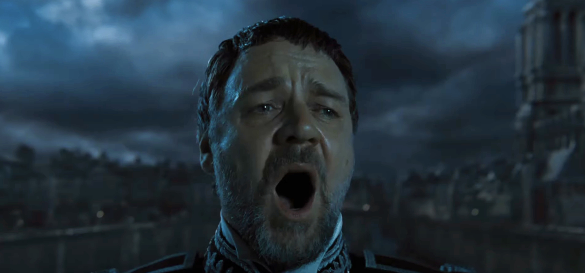 Russell Crowe dramatically singing in a scene from the movie Les Misérables