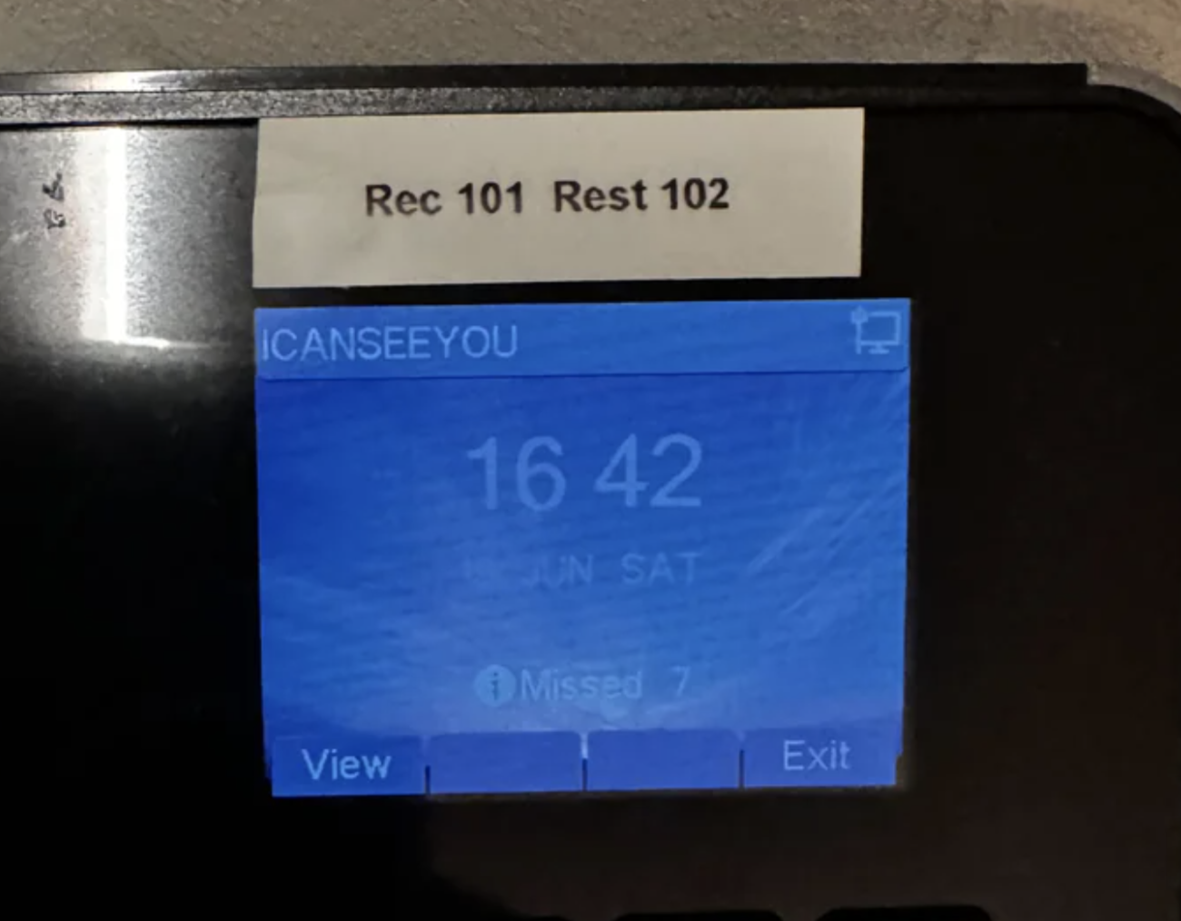 A digital screen shows a message, "I CAN SEE YOU," the time 16:42, and 7 missed notifications. Labels above read "Rec 101" and "Rest 102."