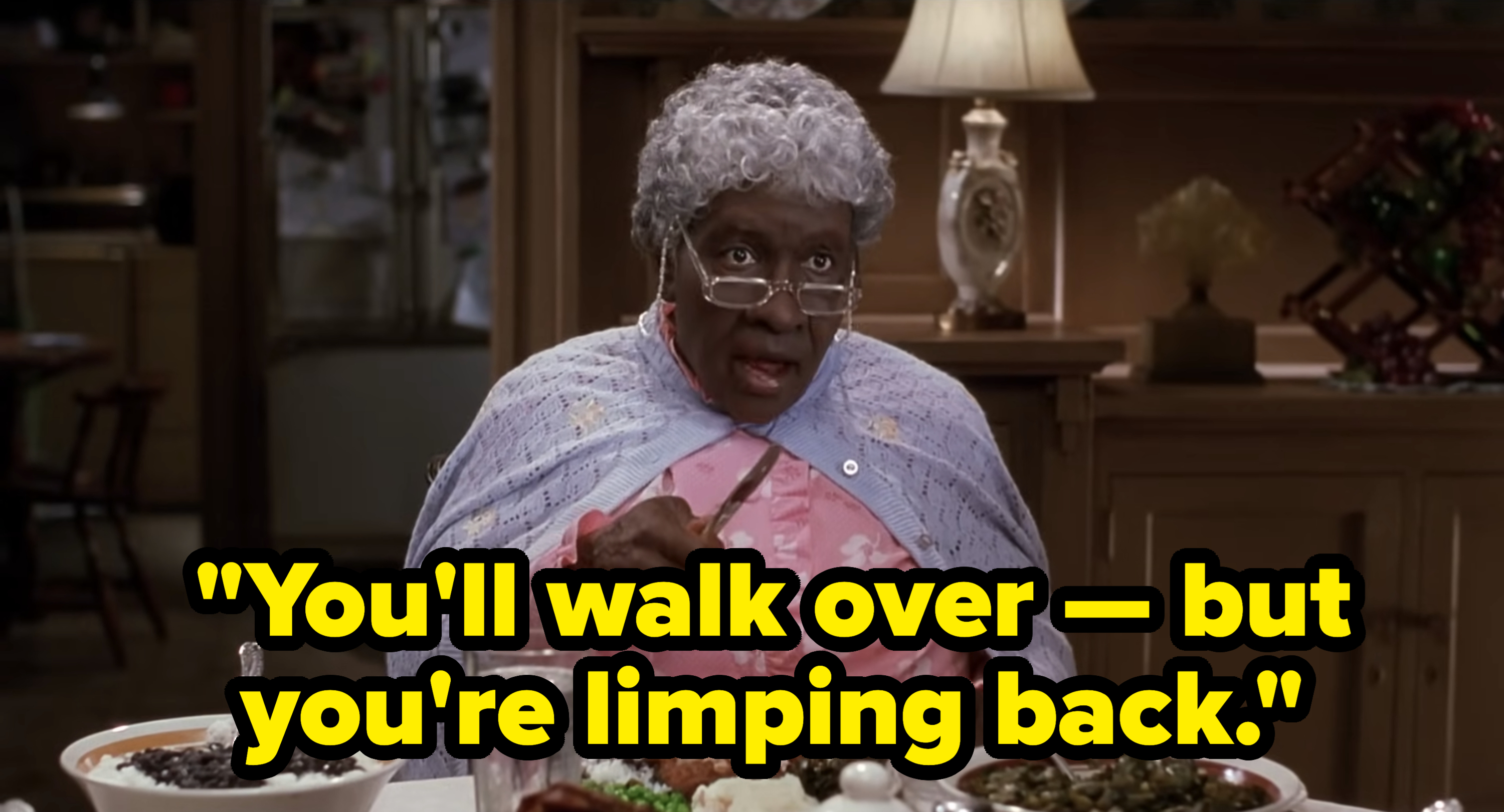 Eddie Murphy dressed as a grandma in "The Nutty Professor" sits at a dining table wearing glasses and a shawl, pointing her finger. Text reads "You'll walk over — but you're limping back."