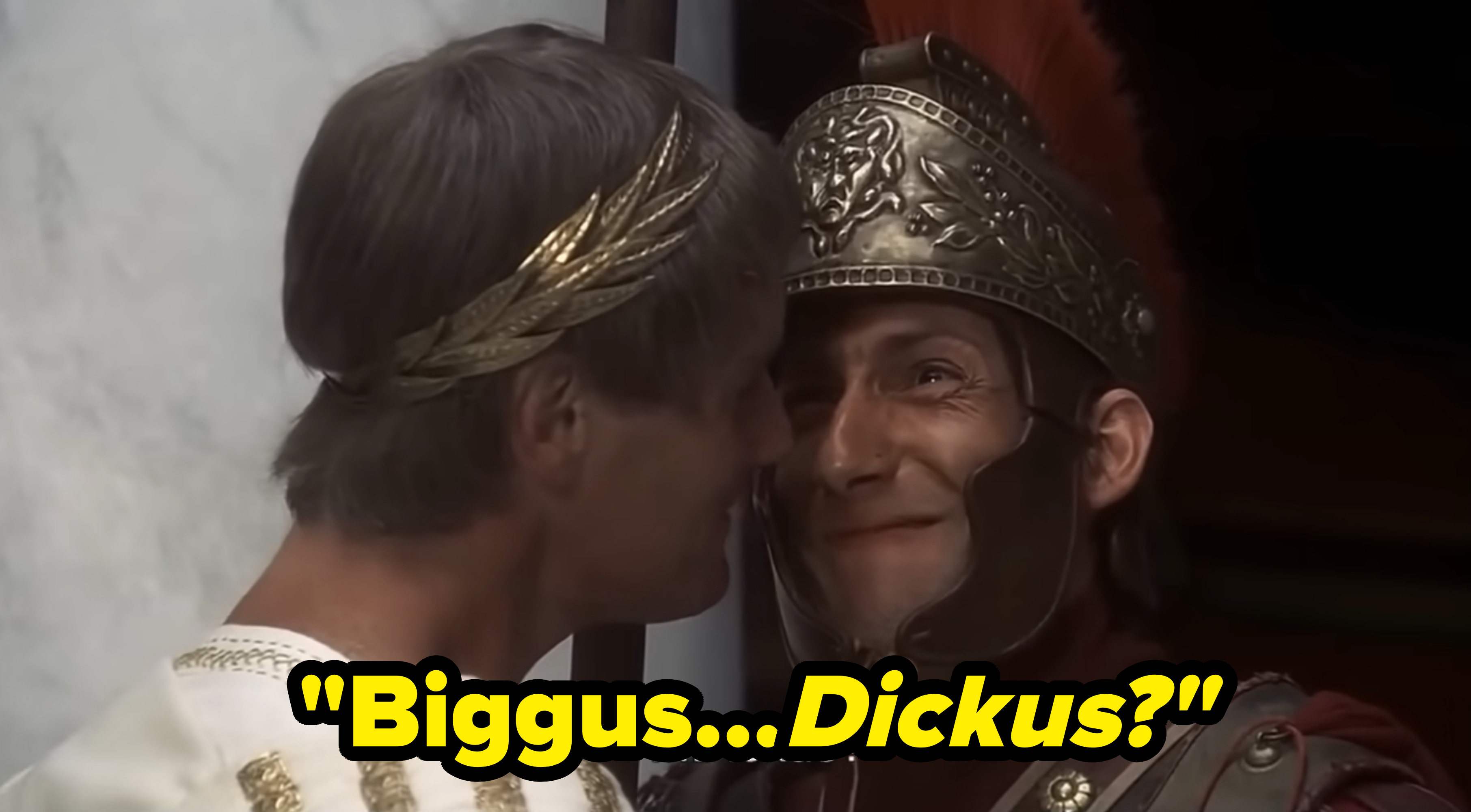 Two men in Roman attire, one with a stern expression and the other in ornate armor, share a close moment. Text on image: "Biggus Dickus?"