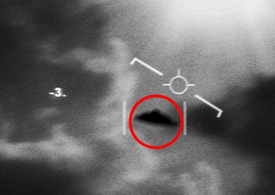Military radar screen showing a triangular unidentified flying object (UFO) circled in red with various technical readings displayed on the screen