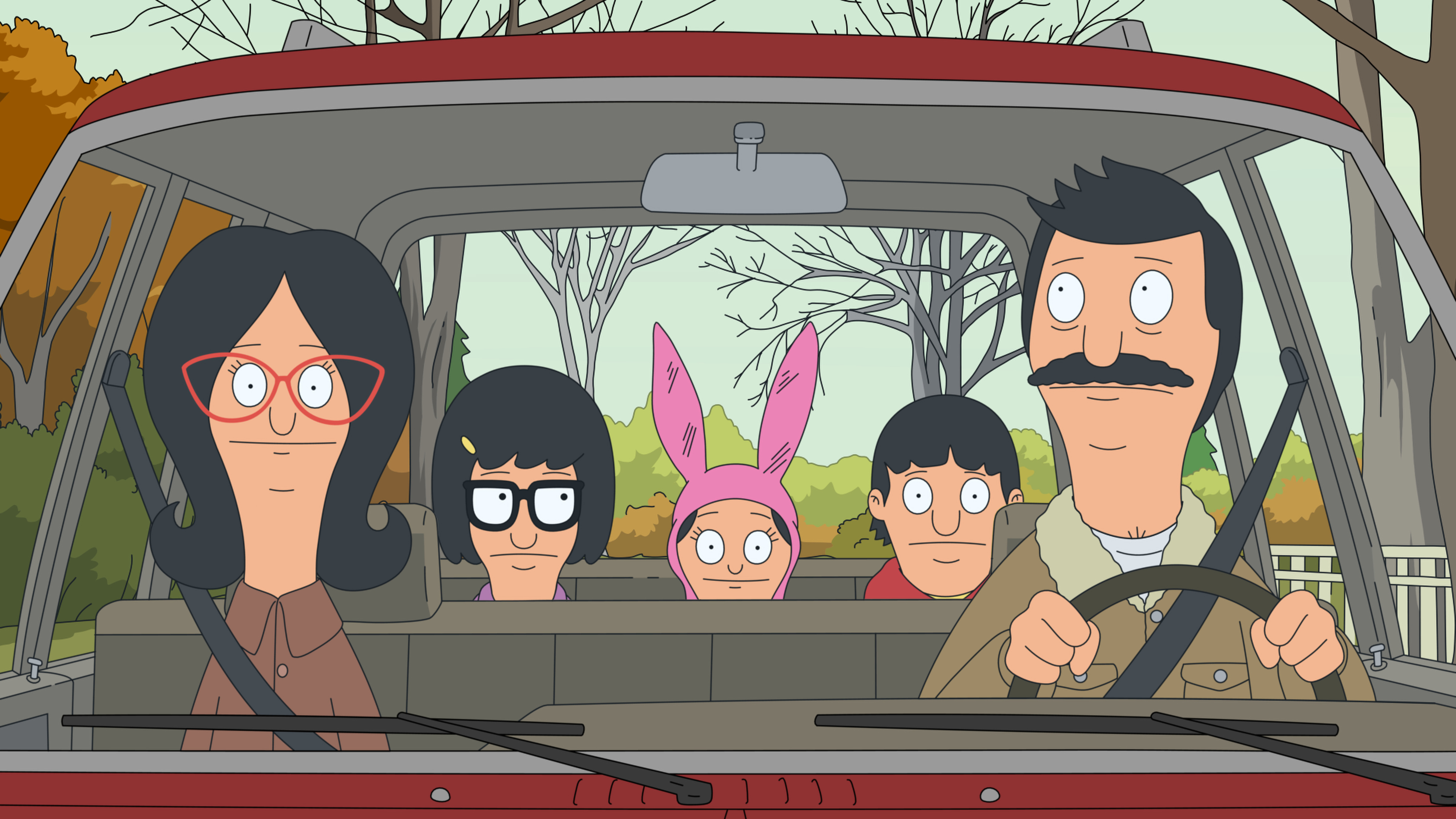 The Belcher family from Bob's Burgers is in a car, with Bob driving and Linda in the passenger seat, while their children Tina, Louise, and Gene are in the backseat