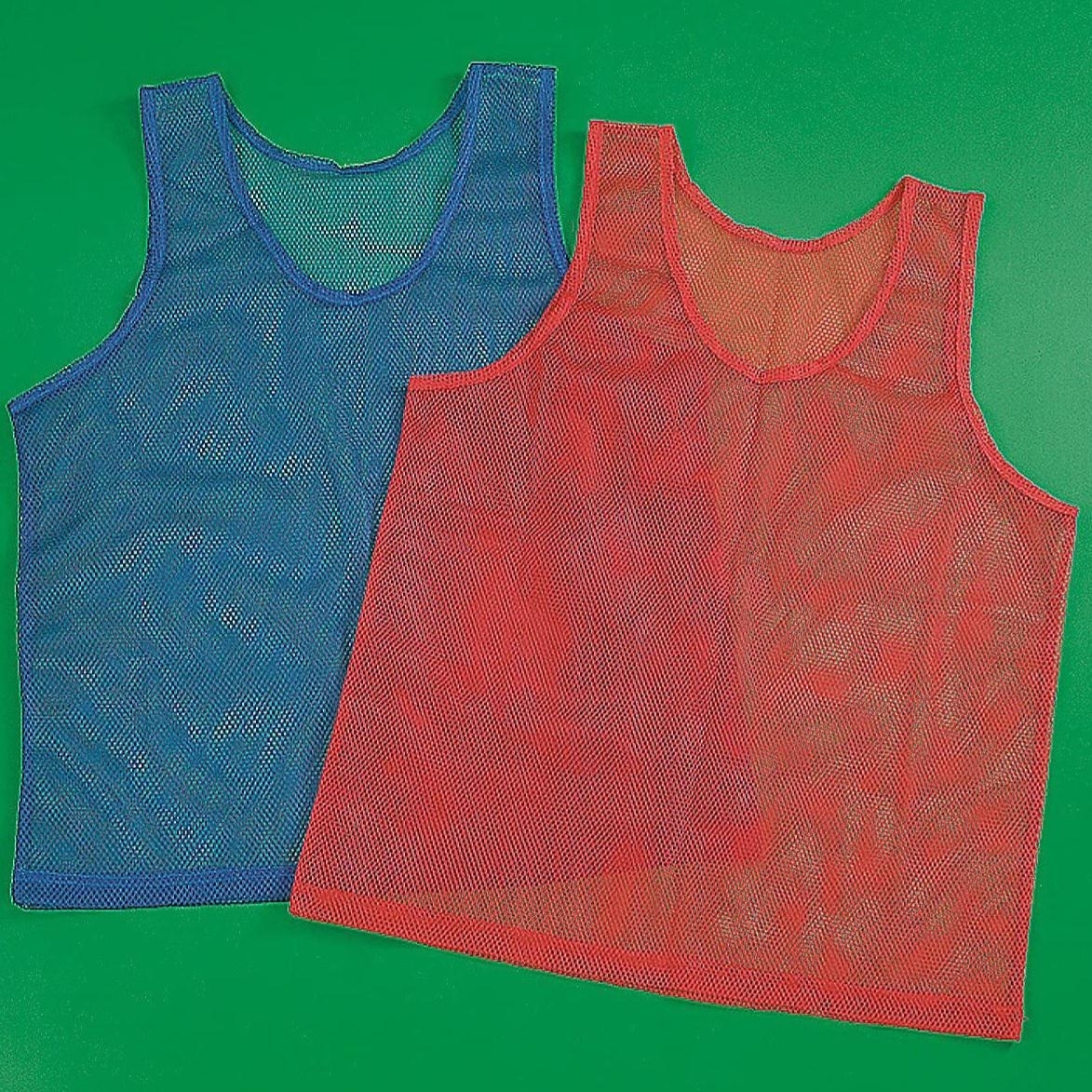 A collection of colorful sports pinnies arranged in a circle, with a red rectangular piece of fabric placed nearby