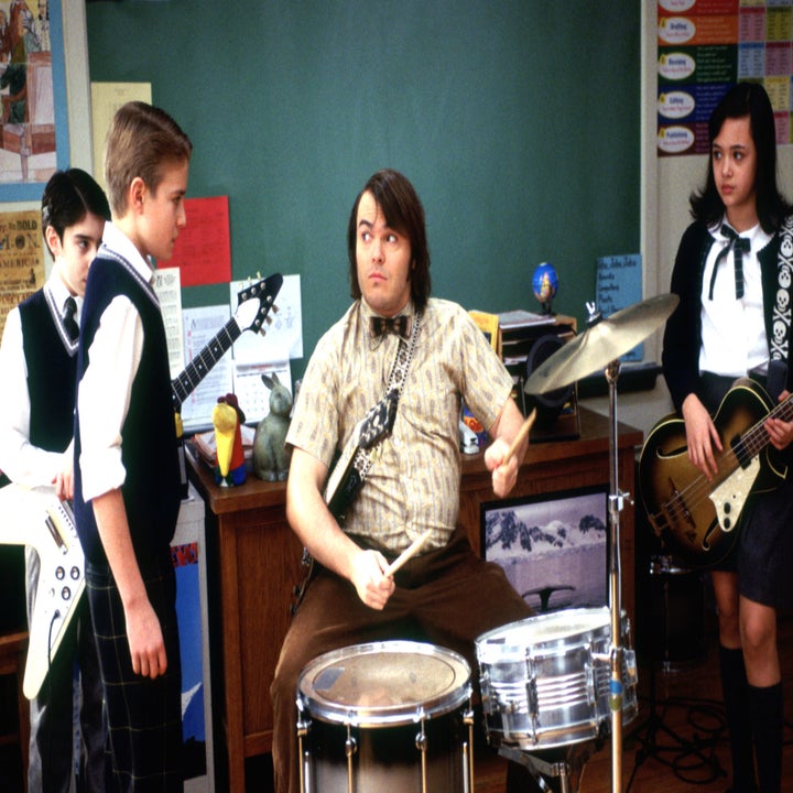 Jack Black plays drums in a classroom, surrounded by young students