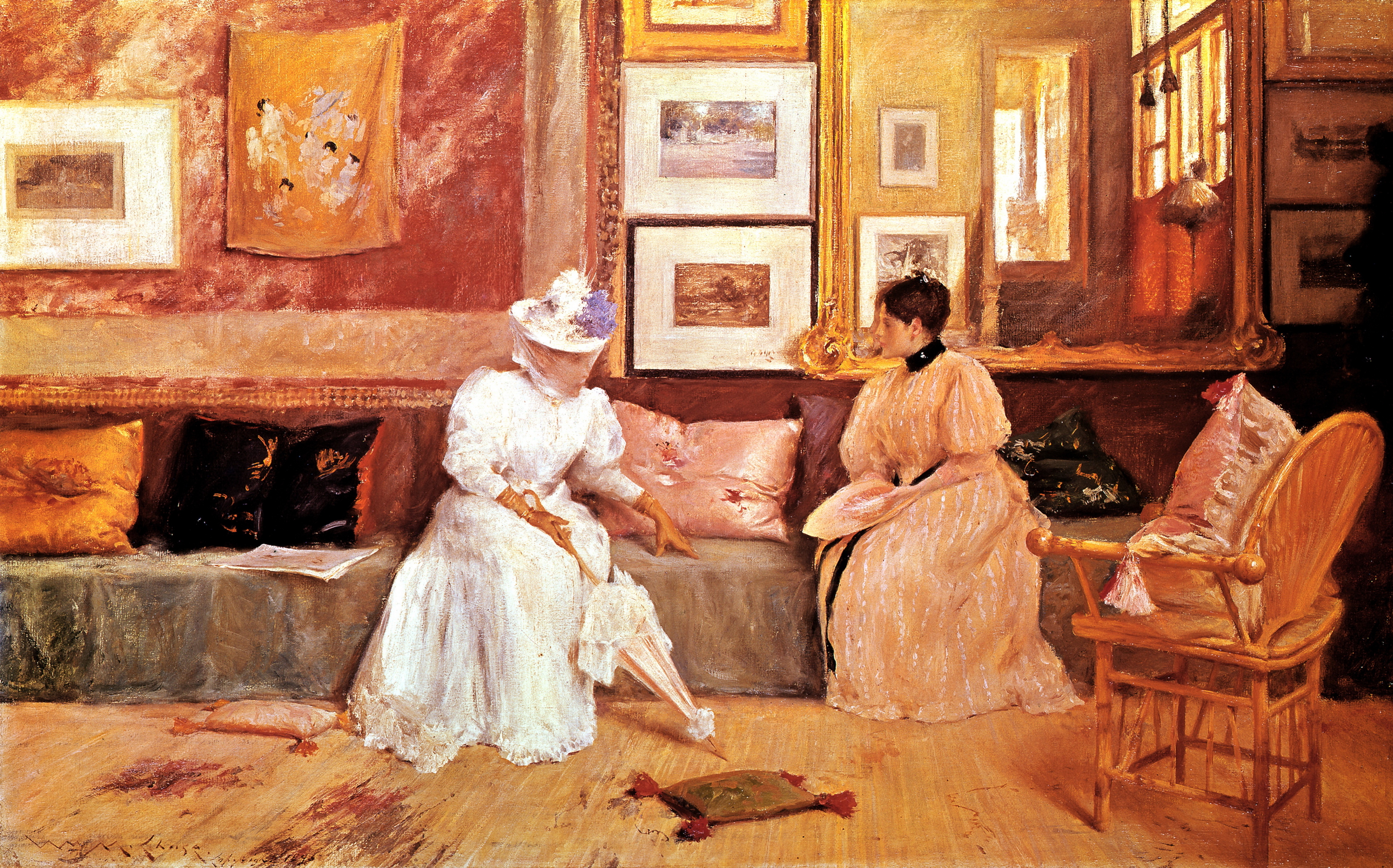 Two women, dressed in elegant 19th-century attire, are seated and engaged in conversation in a richly decorated sitting room with framed art on the walls
