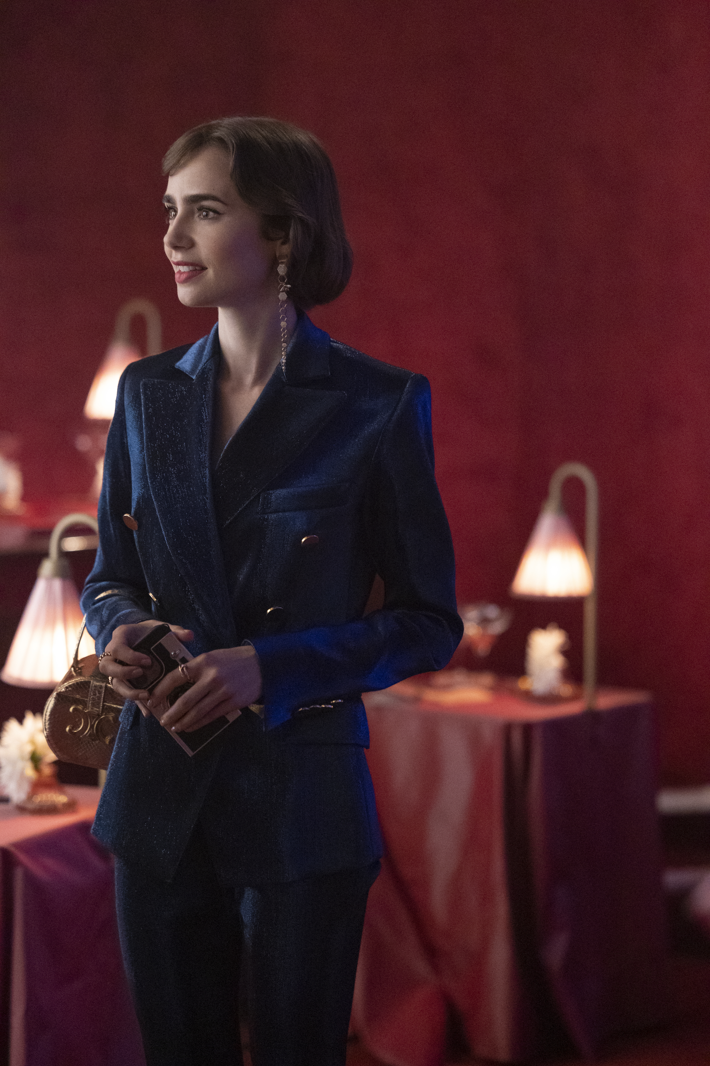 Lily Collins in a velvet power suit in "Emily in Paris."