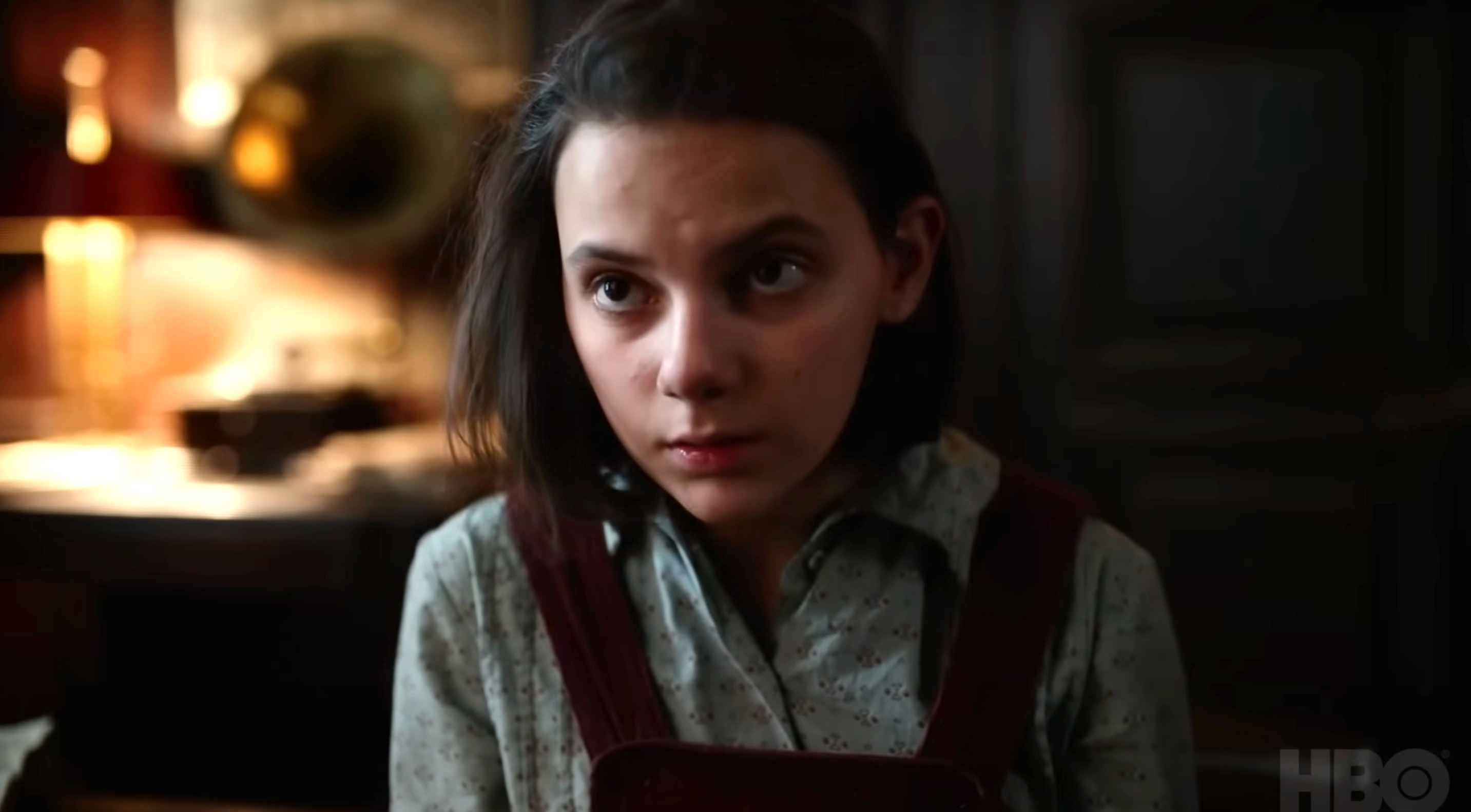 Dafne Keen as Lyra Belacqua looks pensively in a scene from HBO's "His Dark Materials."