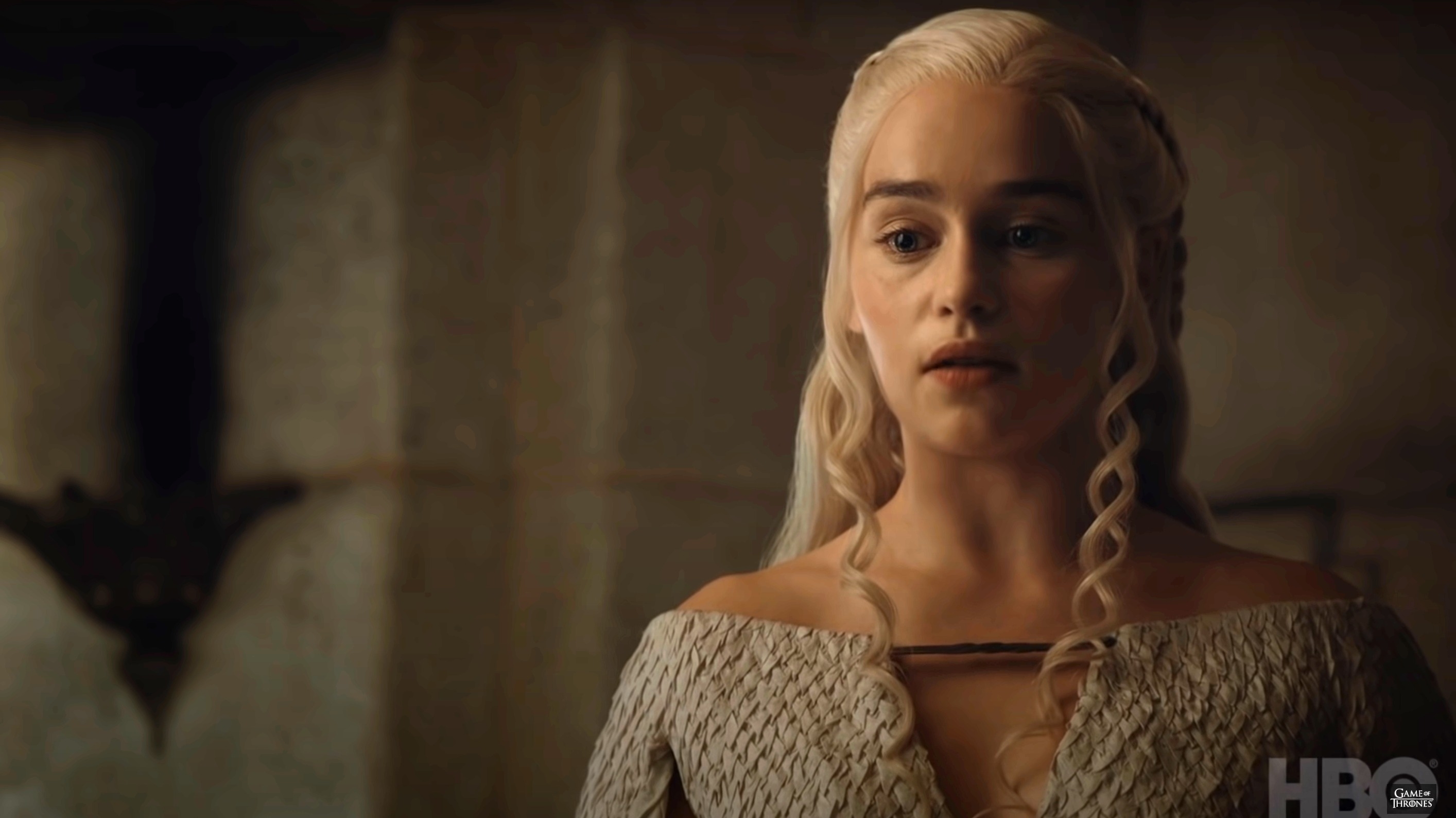 Daenerys Targaryen, from Game of Thrones, wearing a detailed medieval-style dress, is looking slightly downward with a focused expression