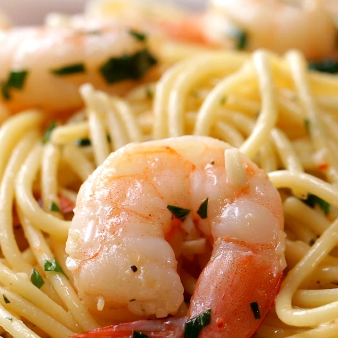 Close-up of spaghetti with shrimp, garnished with parsley