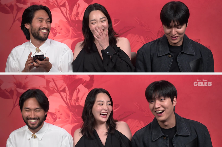 Steven Yeun, Rosaline Tang, and Lee Min-ho share a laugh in front of a floral backdrop during a BuzzFeed Celeb interview