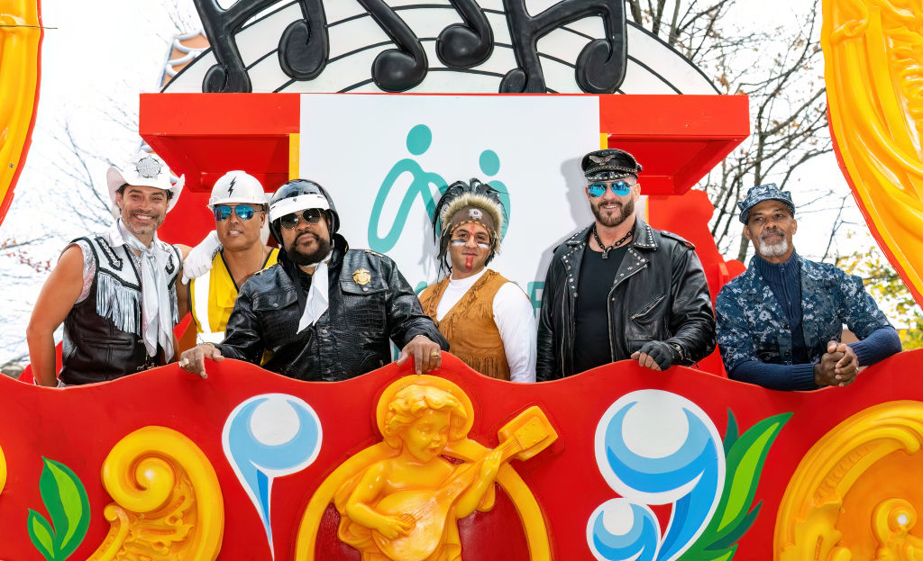 The Village People members are shown at a parade