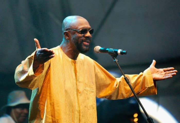 Isaac Hayes speaking into a microphone