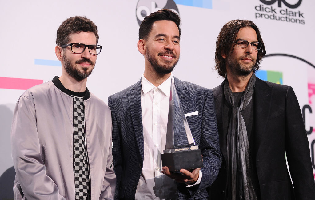 Joe Hahn, Mike Shinoda, and Brad Delson of Linkin Park holding an award