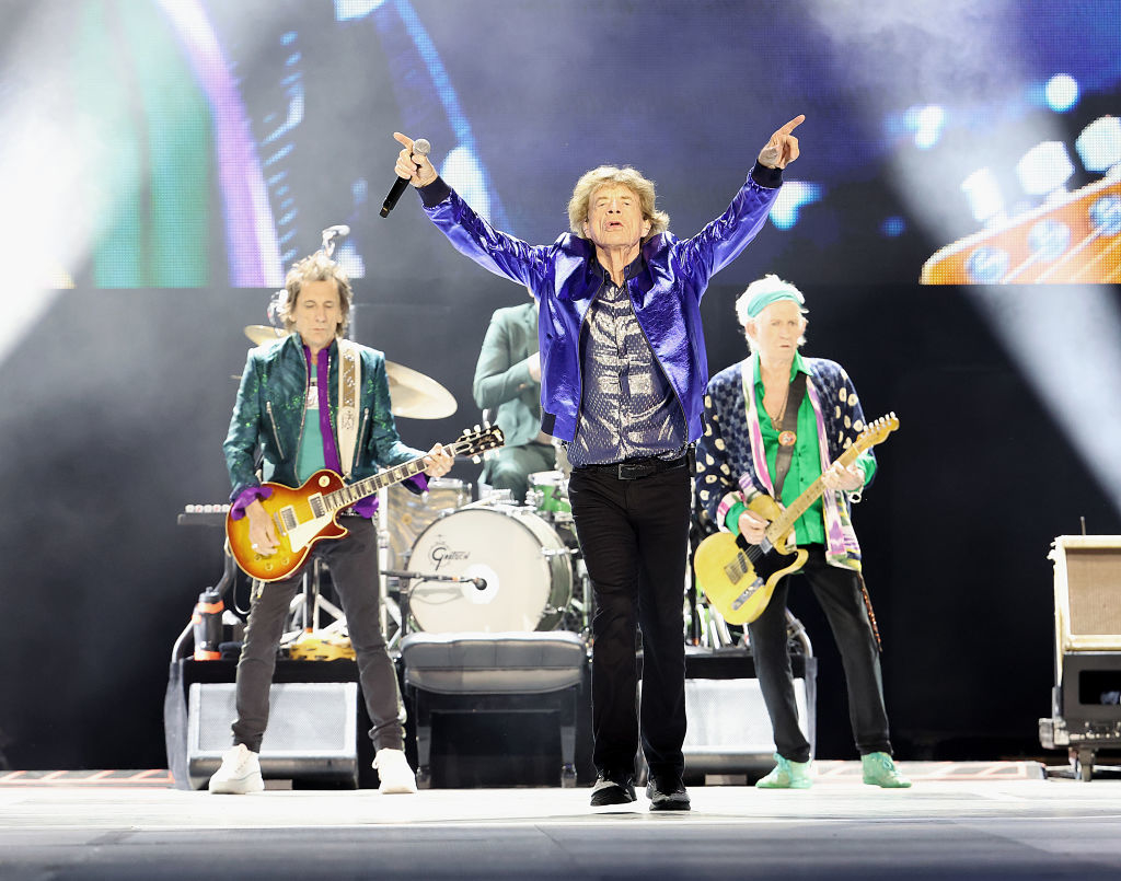 Mick Jagger, Keith Richards, and Ronnie Wood of The Rolling Stones perform on stage