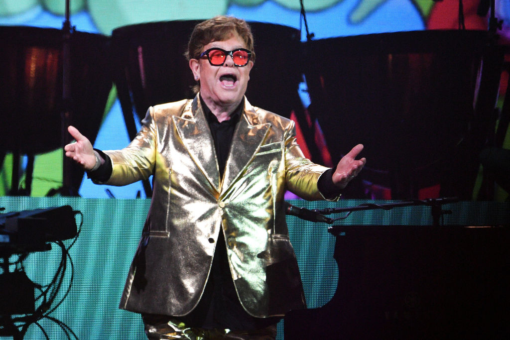 Elton John performs on stage