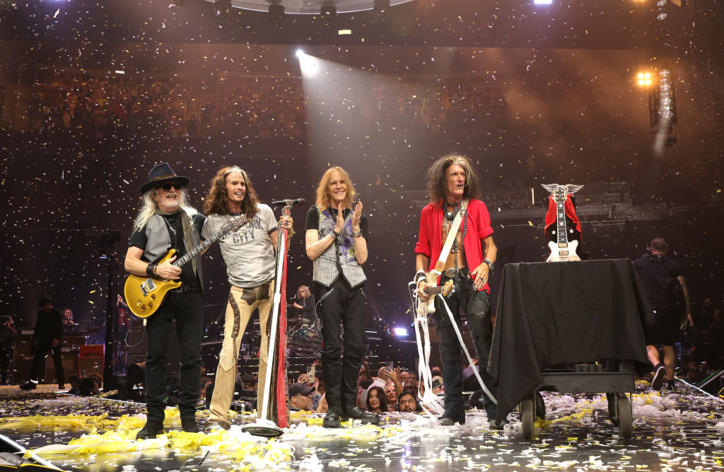 Aerosmith stands on stage amid confetti