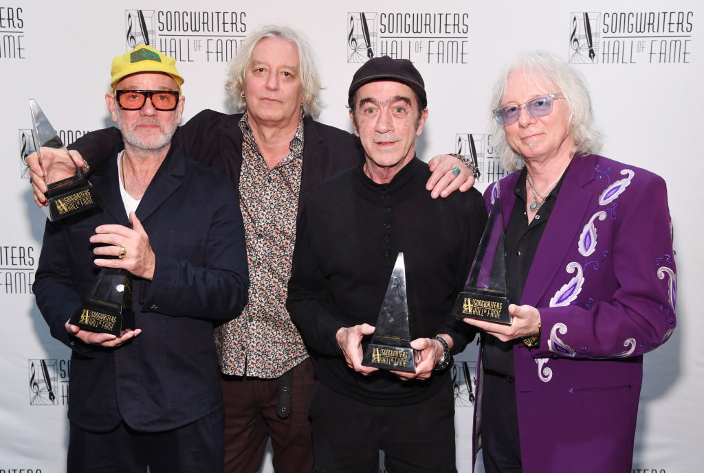 R.E.M. holding awards at the Songwriters Hall of Fame