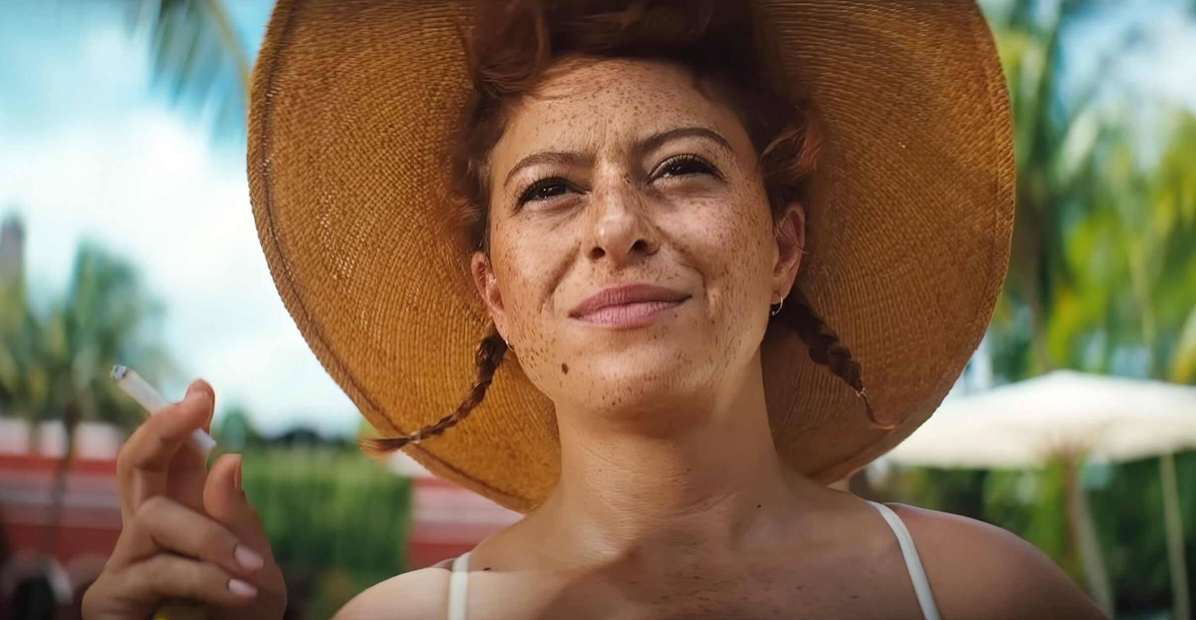 Alia Shawkat wearing a hat with her hair in braids in &quot;Blink Twice&quot;