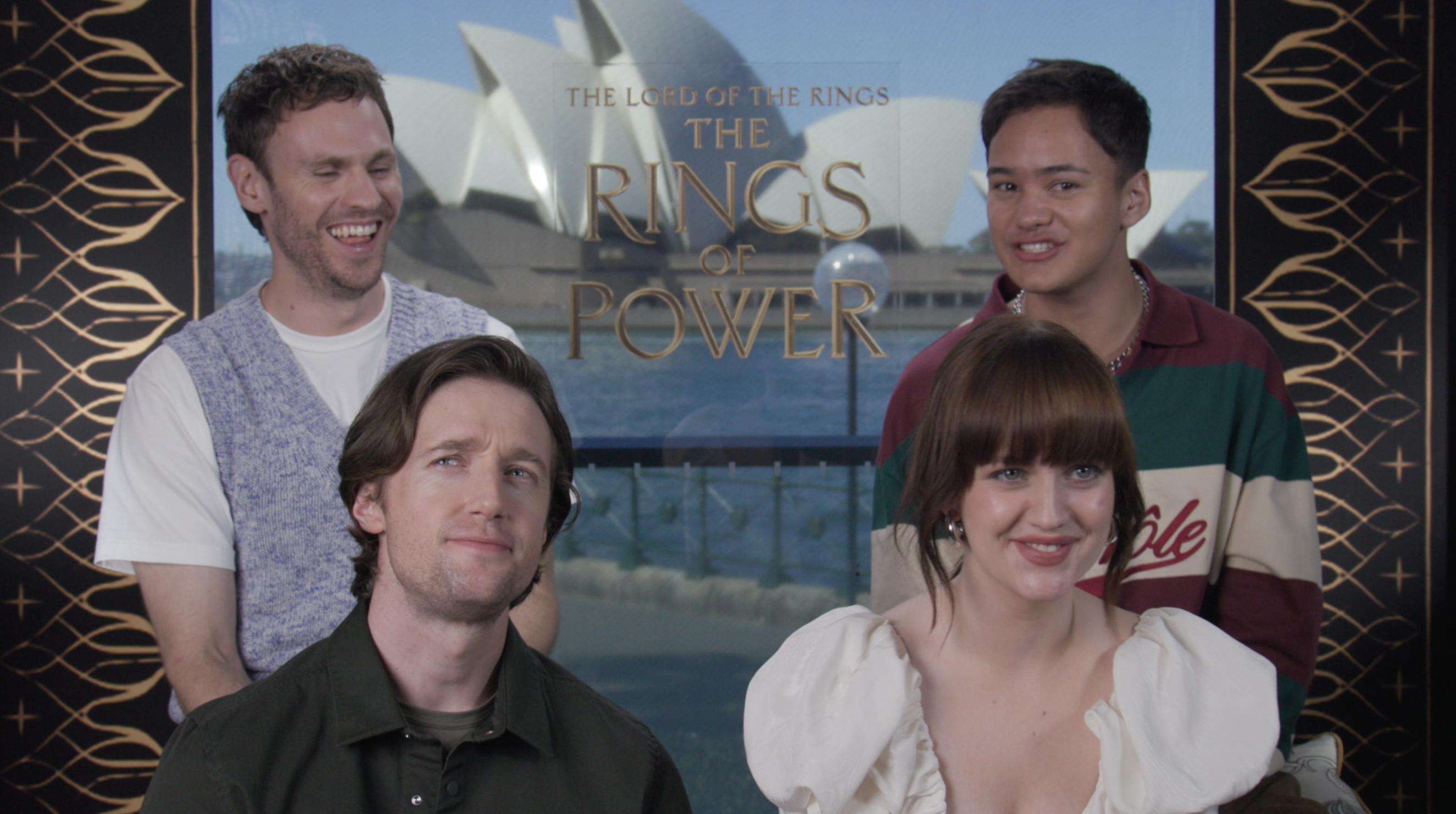 Four actors from "The Lord of The Rings: The Rings of Power" pose in front of a backdrop. Sydney Opera House and title text visible
