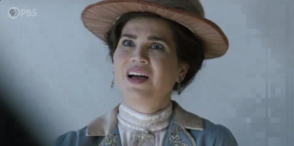 A woman in period costume, featuring a large hat and detailed clothing, appears surprised. The PBS logo is in the upper left corner