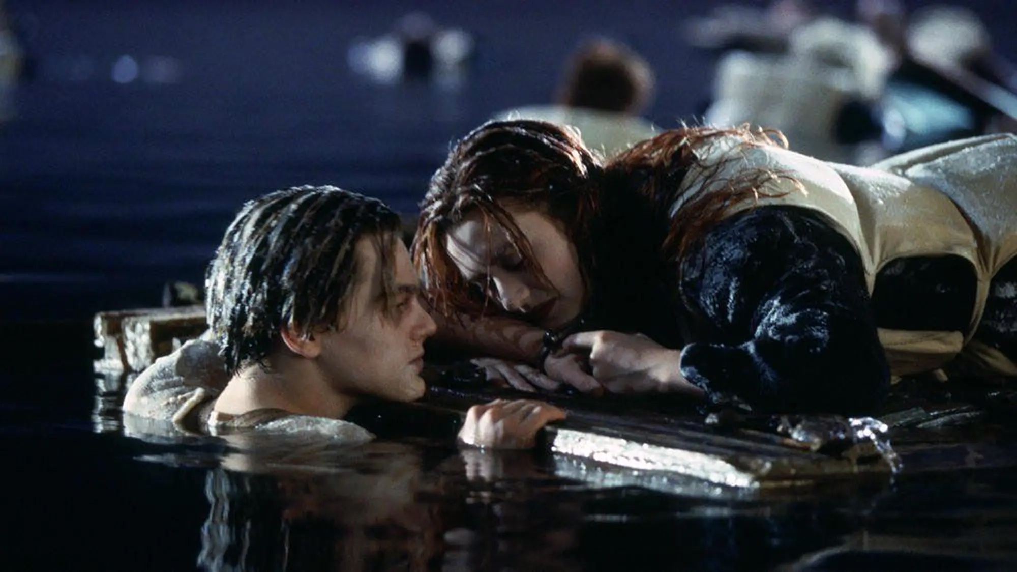 Leonardo DiCaprio and Kate Winslet in a scene from &quot;Titanic&quot; where they cling to a floating door in icy water