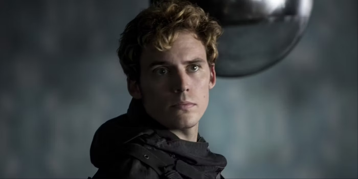 Sam Claflin as Finnick Odair appears in a scene from &quot;The Hunger Games&quot; series, wearing a dark, tactical outfit