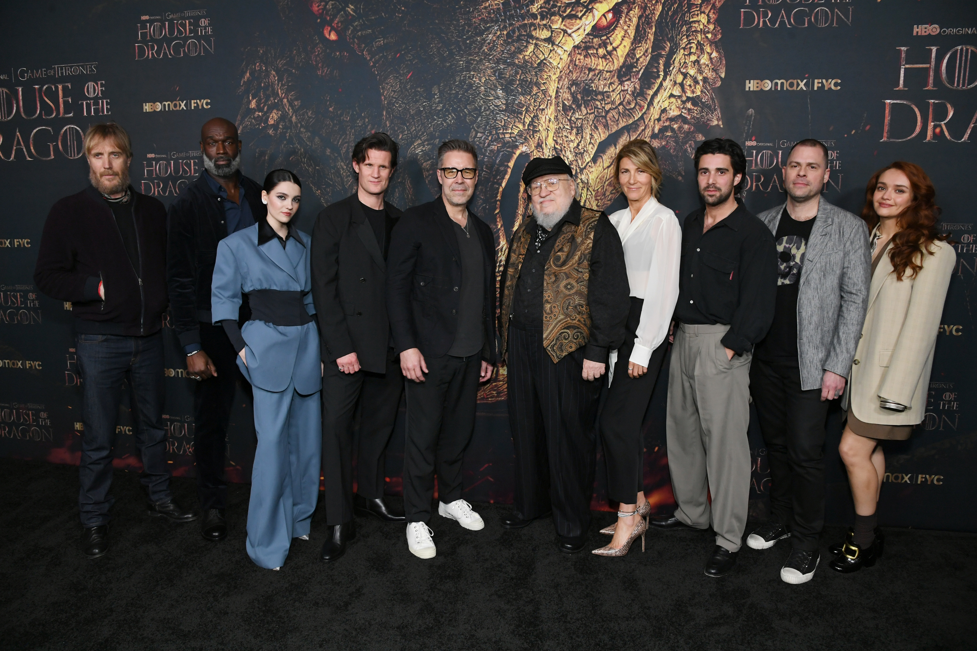 Group photo of House of the Dragon cast and creators including George R.R. Martin, Matt Smith, Emma D'Arcy, Olivia Cooke, and Paddy Considine at an event