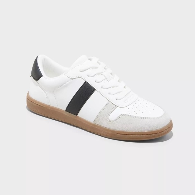 The sneaker with a black stripe on the side, white laces, and a light brown sole