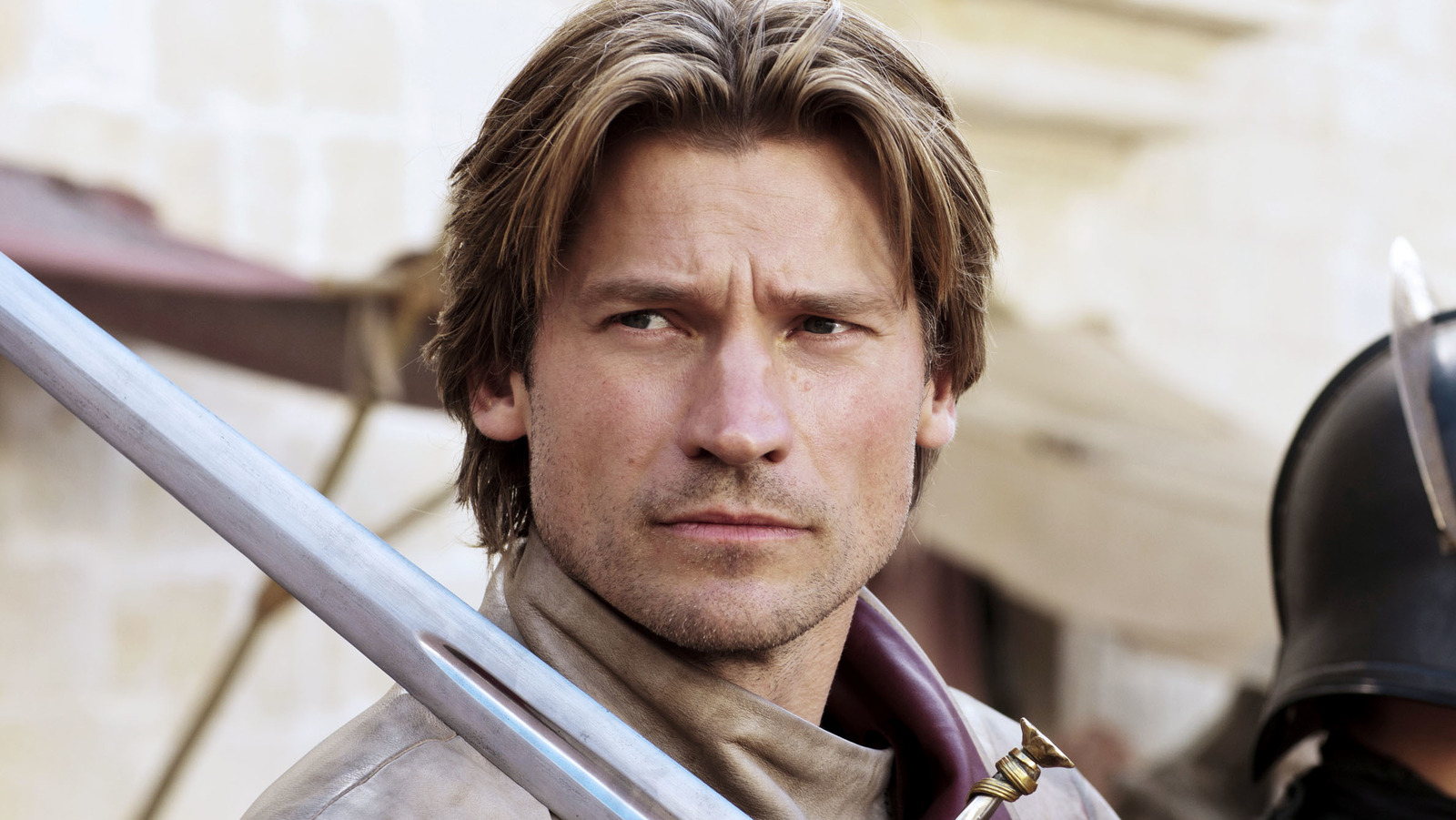 Nikolaj Coster-Waldau as Jaime Lannister from Game of Thrones, dressed in medieval-inspired armor and holding a sword