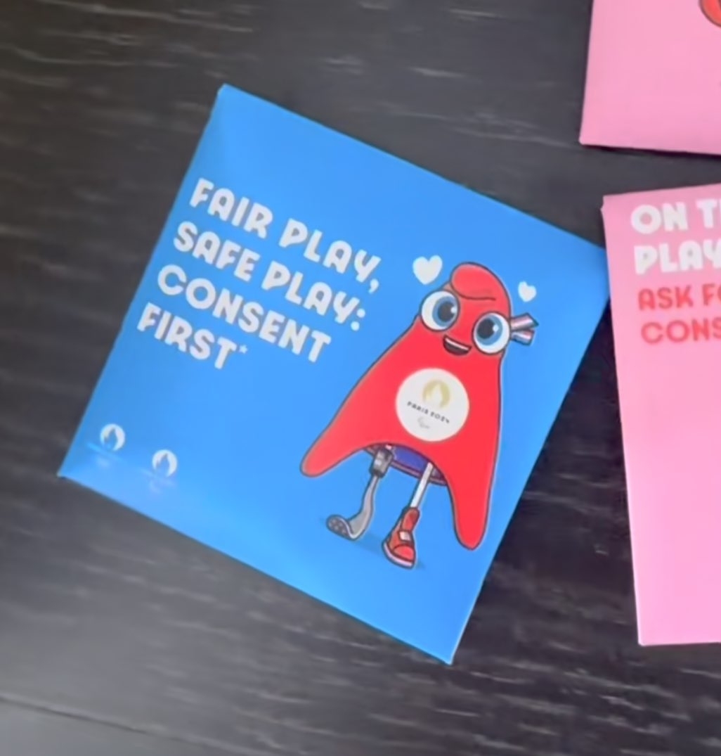 A blue and a pink card with texts promoting fair play and safe play through consent. The blue card reads, &quot;Fair Play, Safe Play: Consent First.&quot; The pink card reads, &quot;On the Court: Ask For Consent.&quot;