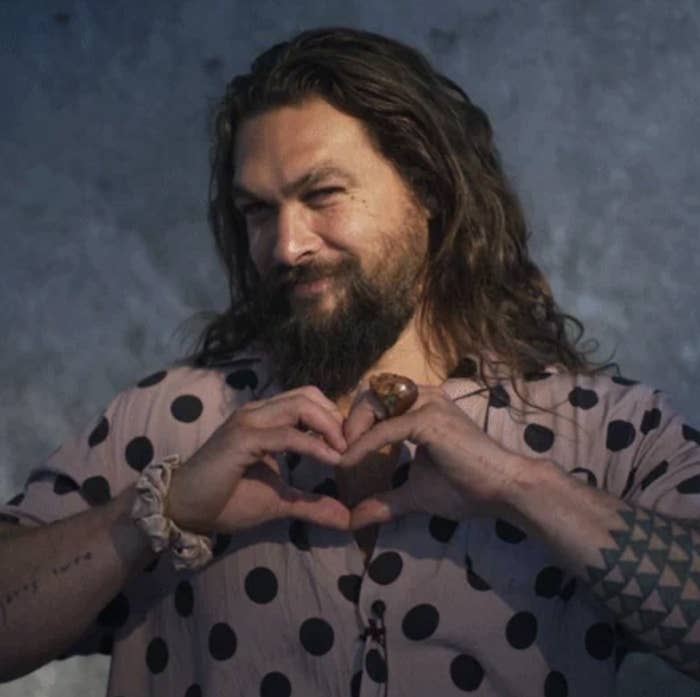 Jason Momoa making heart sign out of hands