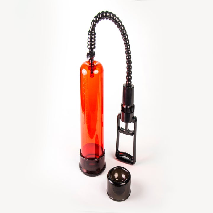 A clear vacuum erectile dysfunction pump with a cylindrical chamber, a hand-held pump, and a detachable base