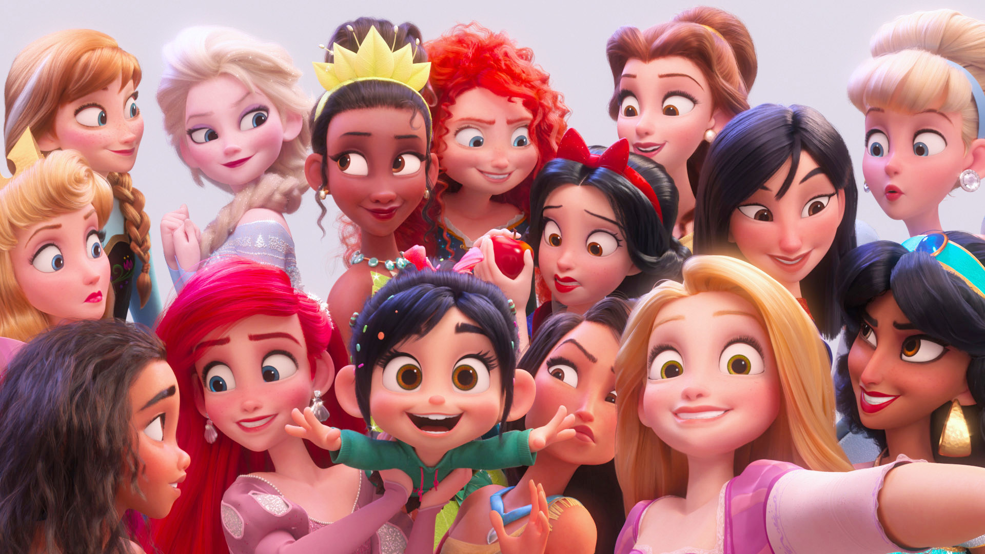 Vanellope von Schweetz takes a selfie with Disney princesses: Ariel, Belle, Elsa, Cinderella, Tiana, Merida, Snow White, Mulan, Rapunzel, Jasmine, Aurora, Pocahontas, and Anna