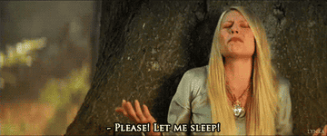 Claire Danes leans against a tree, eyes closed, pleading, "Please! Let me sleep!" in a scene from a movie or show