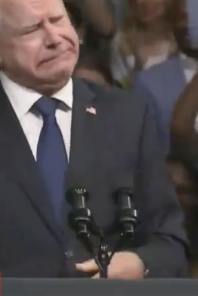 Governor Walz and Vice President Kamala Harris speak at a Harris-Walz rally in Philadelphia. Crowd holds "We Win" signs. MSNBC chyron reports breaking news