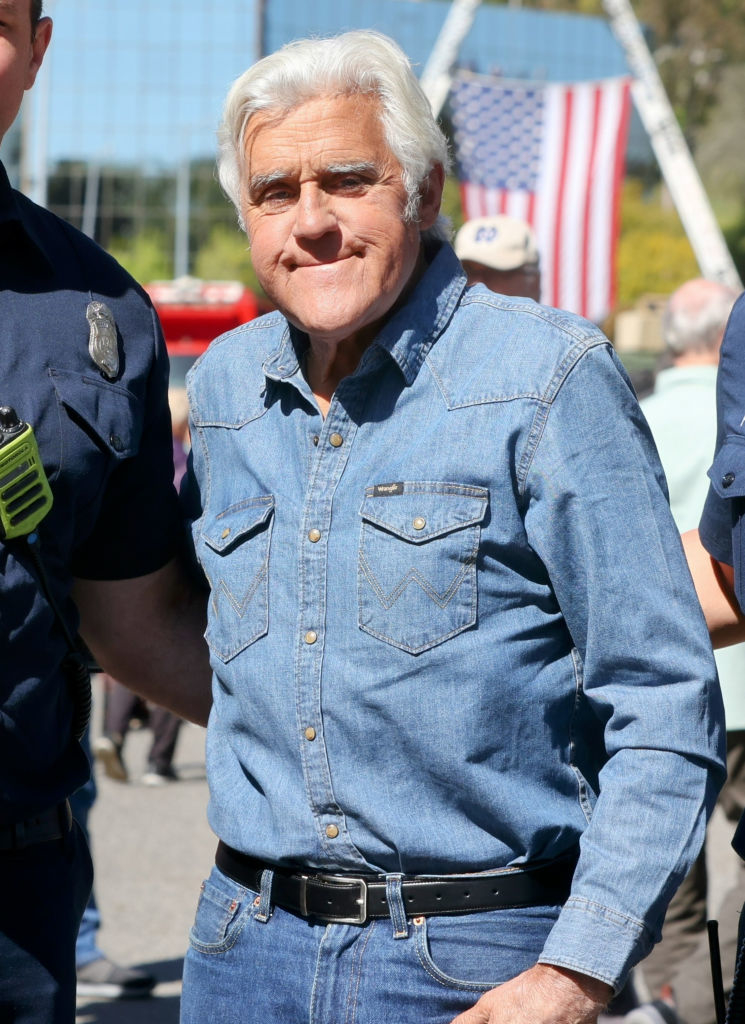 Jay Leno wearing a denim shirt and jeans
