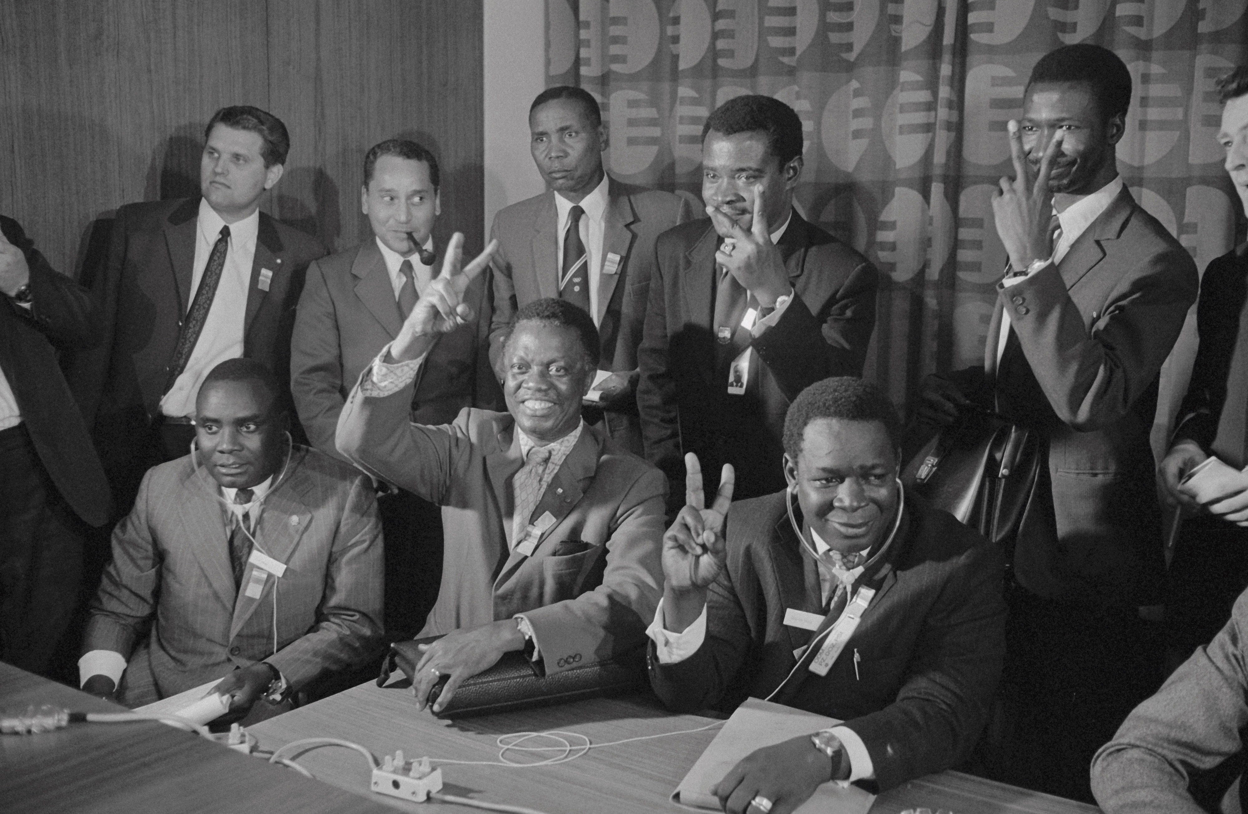 Abraham Ordia (seated left), President of Sports in Africa, and Djibrilla Hirna (seated right), vice president of the group, join others in giving victory sign after the ICC expelled Rhodesia from the Olympic Games
