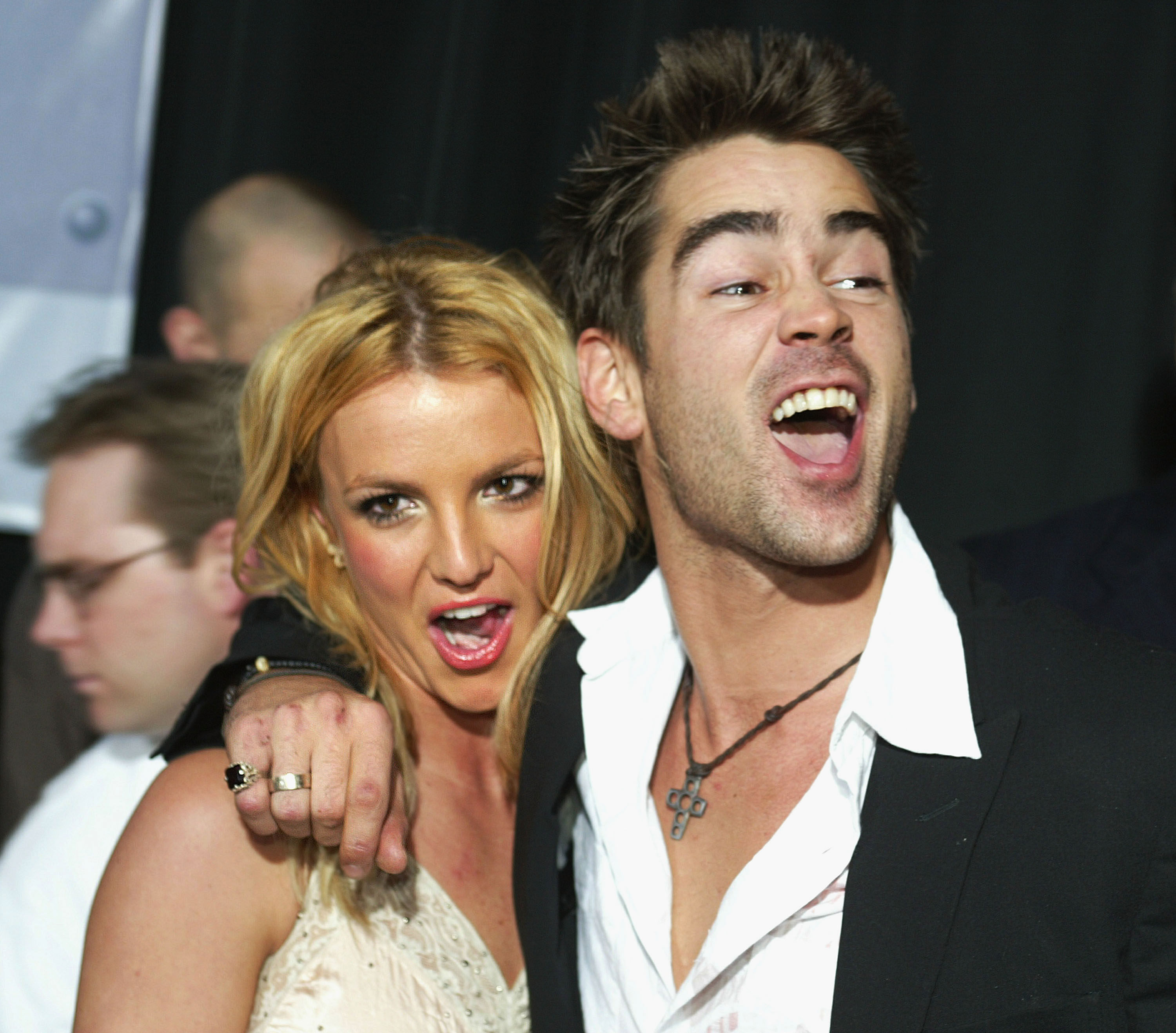 Britney Spears and Colin Farrell are at an event, looking surprised and excited, with Colin&#x27;s arm around Britney&#x27;s shoulder