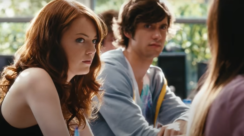 Emma Stone, in a classroom setting, looks at the person next to her
