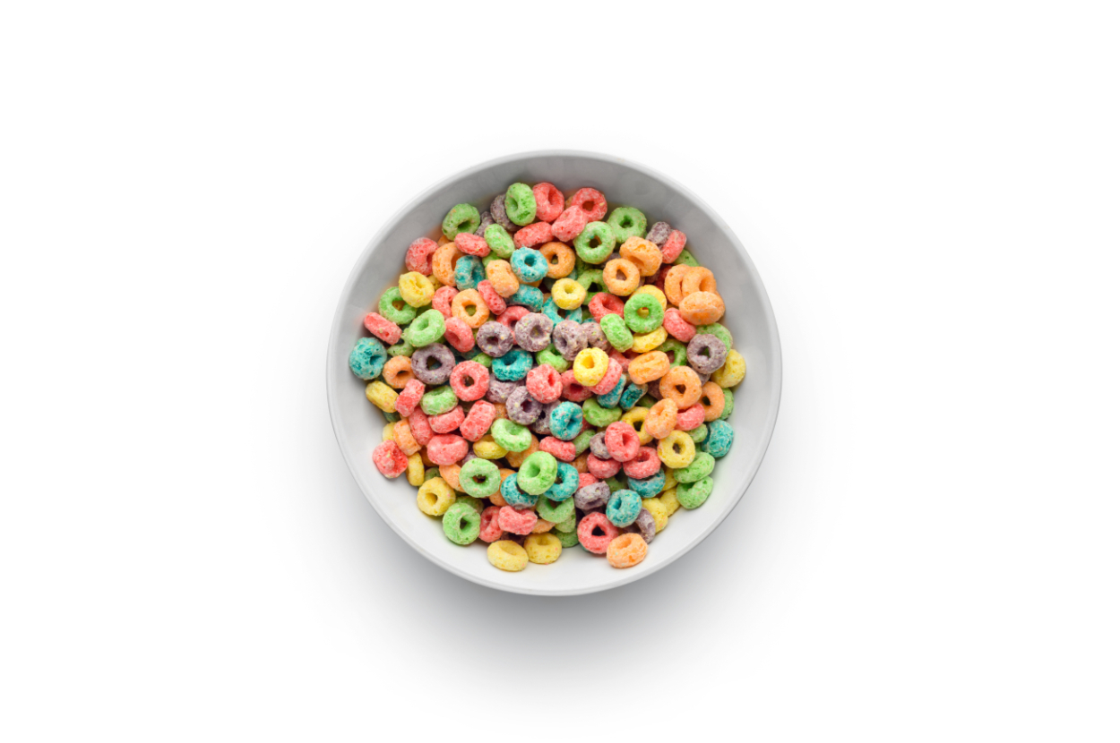 A bowl filled with colorful, loop-shaped breakfast cereal