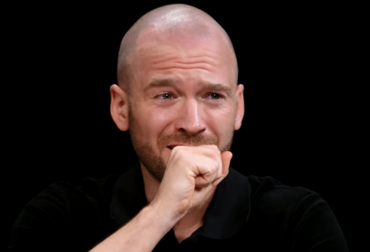 Sean Evans on "Hot Ones" interviewing Ariana Grande, who hits a high note while eating spicy wings. Video trending on YouTube with 2.6M views