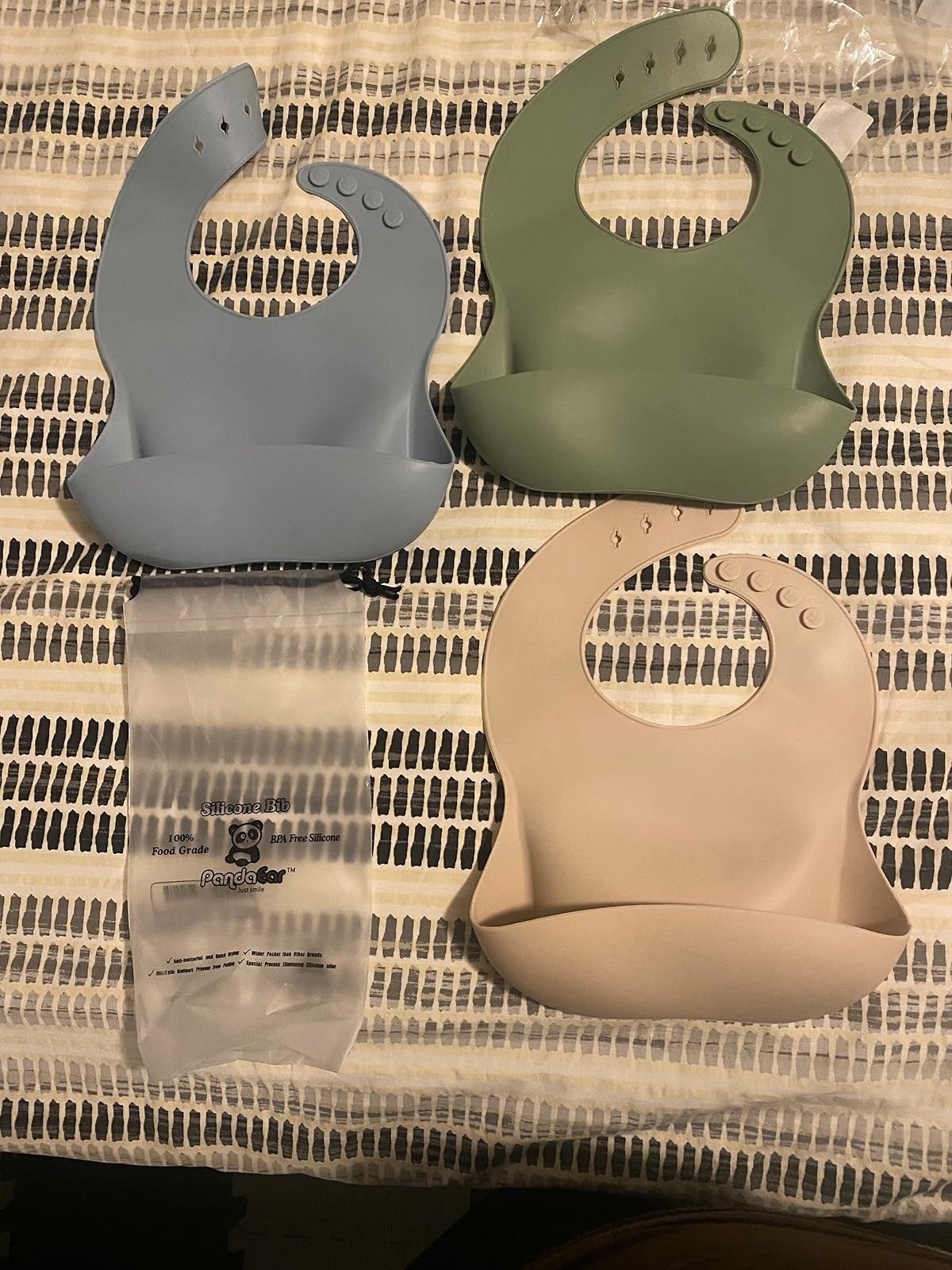  1  blue, 1  green, and 1  beige. Each bib has adjustable drawback   buttons