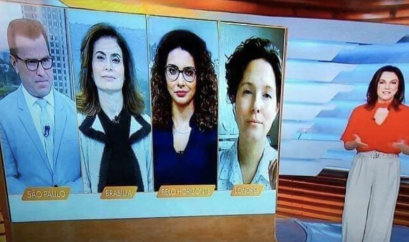 TV news program showing four journalists: São Paulo, Brasília, Belo Horizonte, and London. A fifth journalist stands on the right wearing a red top and light pants