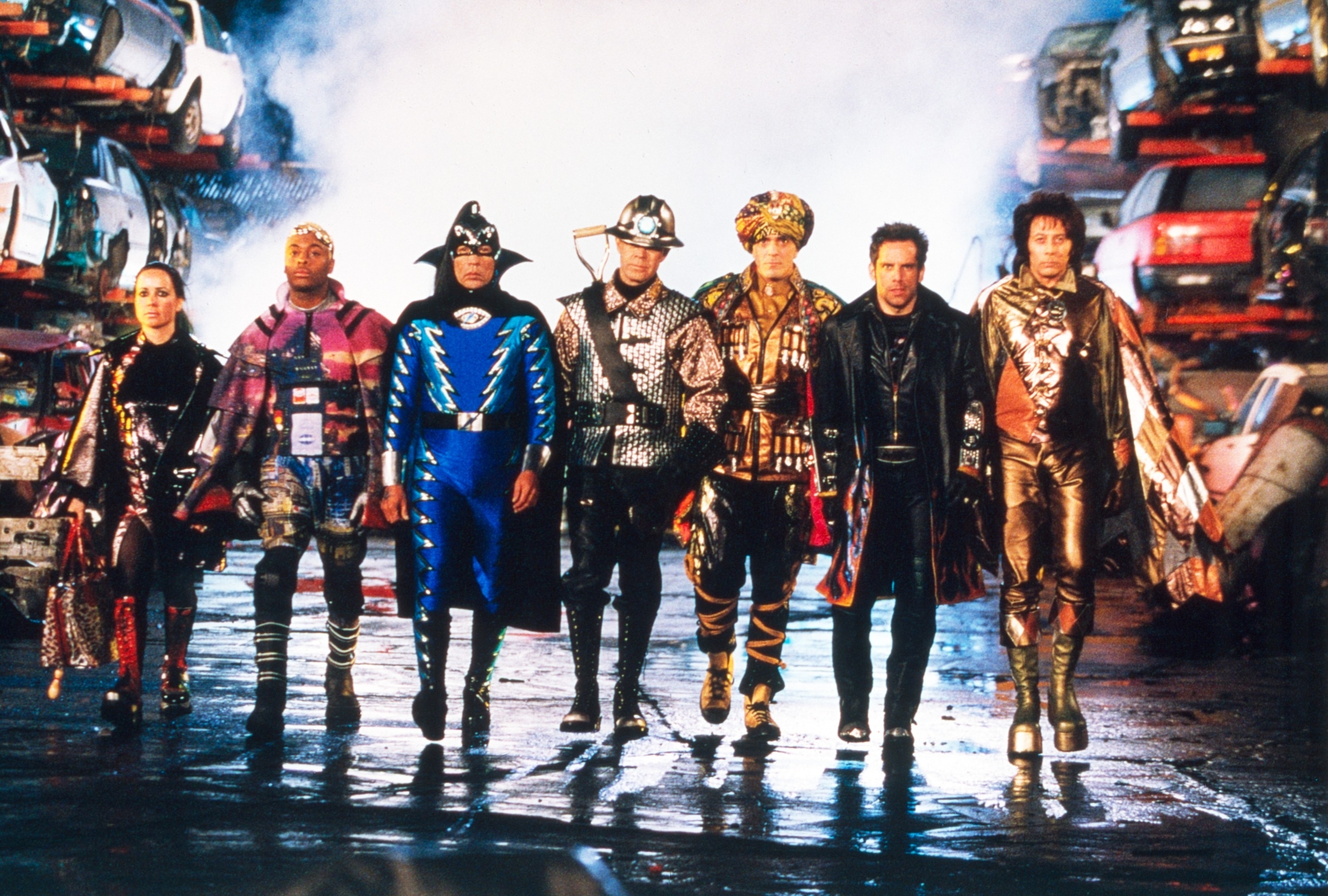 Janeane Garofalo, Kel Mitchell, Wes Studi, William H. Macy, Hank Azaria, Ben Stiller, and Paul Reubens walking in superhero outfits in a scene from "Mystery Men"