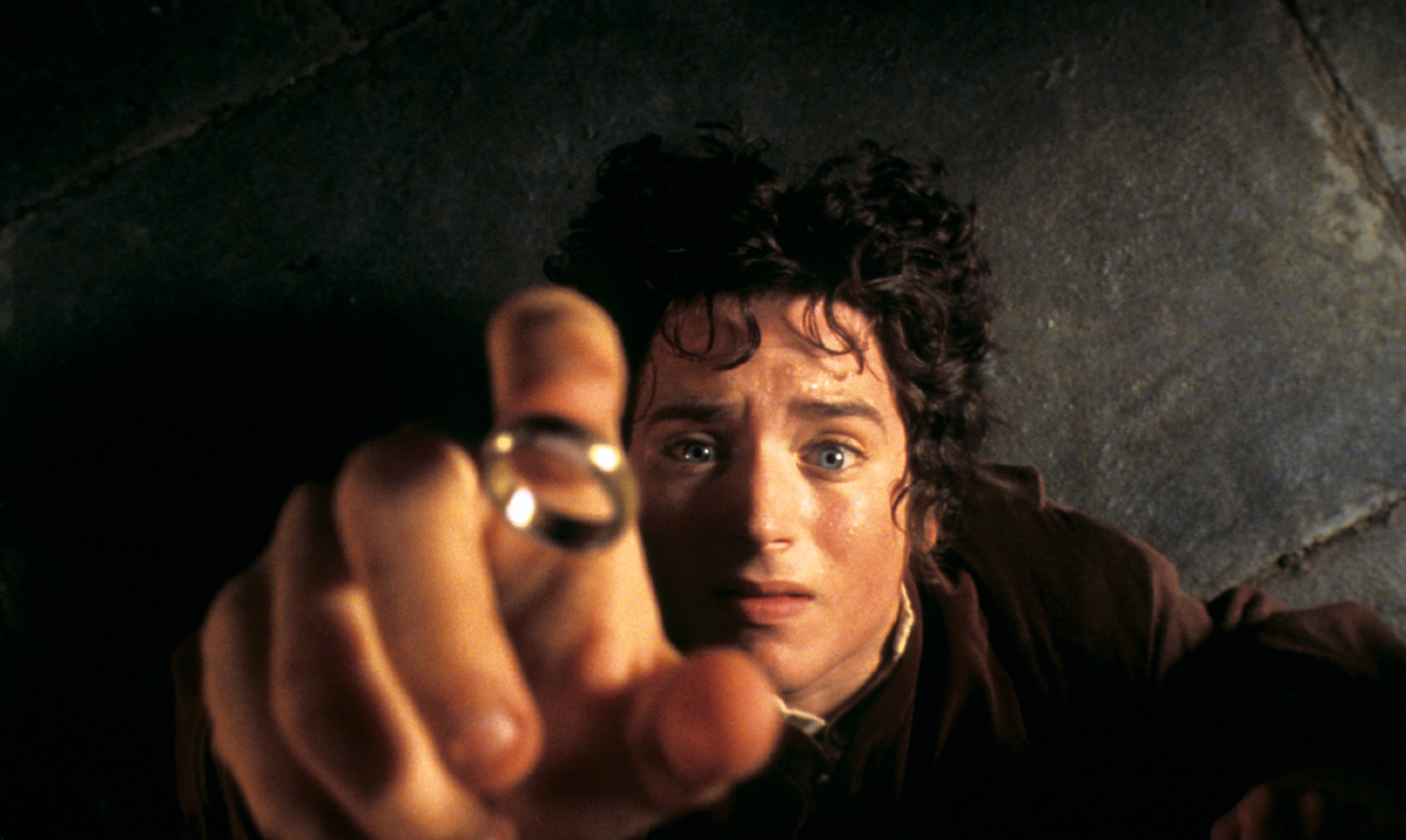 Elijah Wood as Frodo catching a ring in "The Lord of the Rings: The Fellowship of the Rings"