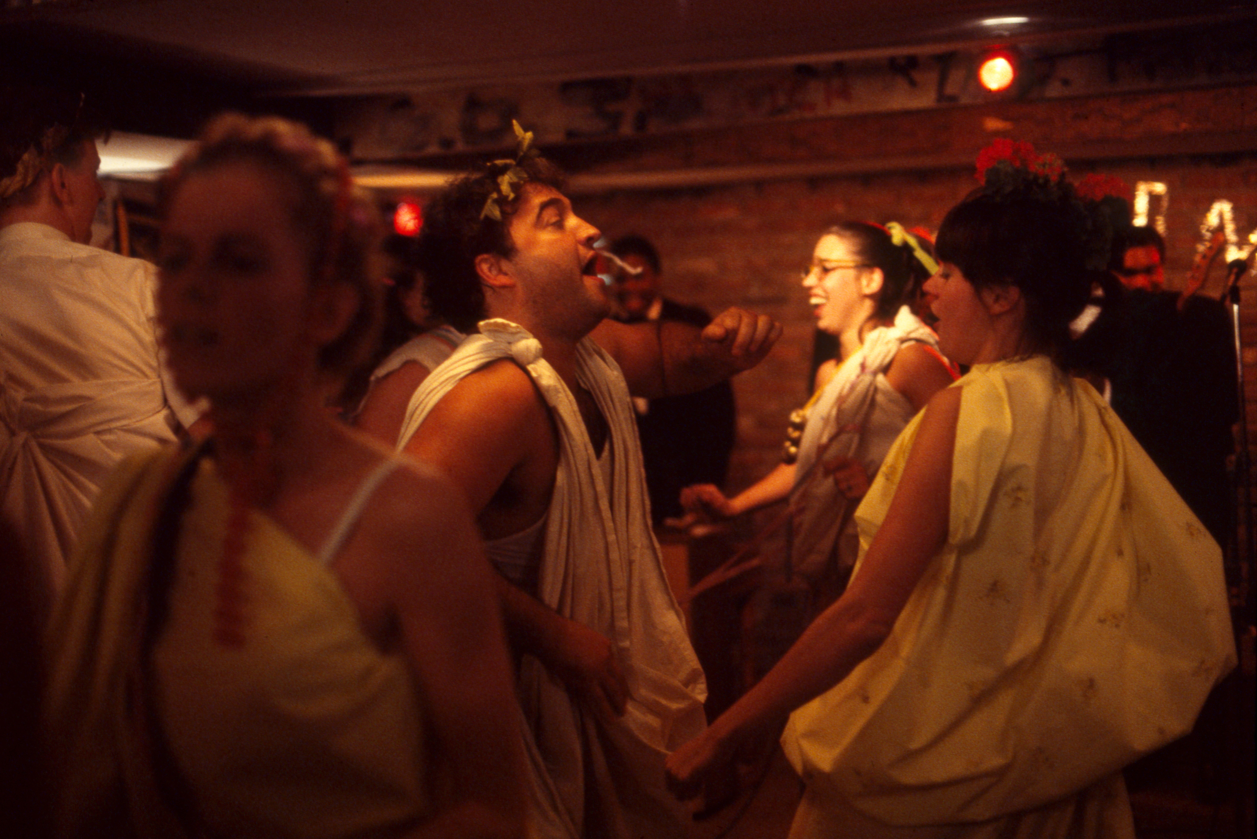 People dancing in togas in a scene from "National Lampoon's Animal House"